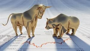 Goldener Bulle und Bär auf Börsenkursen