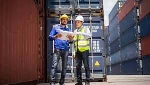 Engineer manager and foreman control or check inventory details of containers box, worker checking quantity of product in containers.