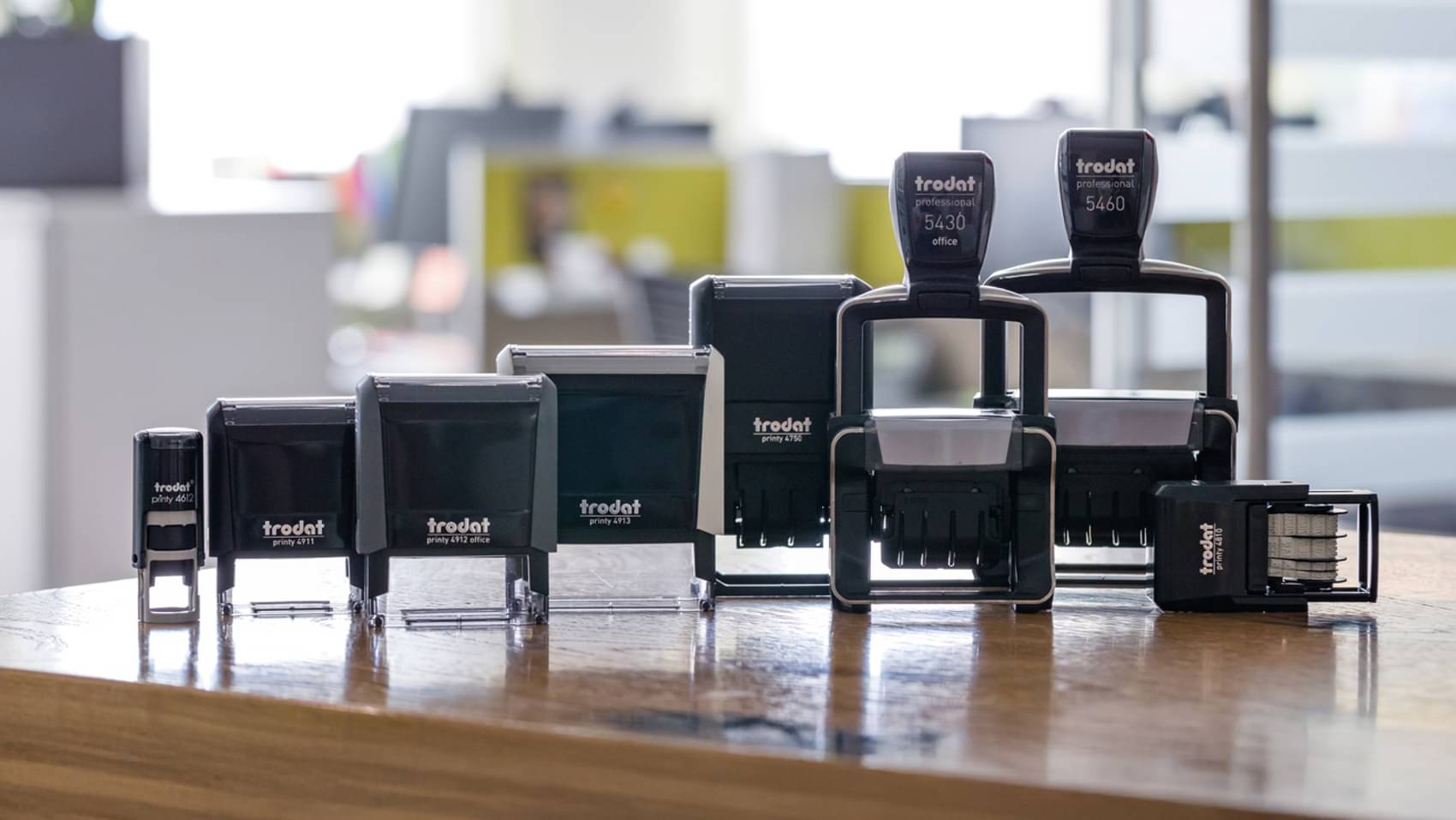 The figure shows the Trodat Professional stamp series set up in an office